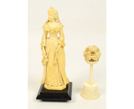 A mid to late 19th century ivory figure of a lady, possibly French, with lace decolletage and cuffs, with a fleur-de-lis cove