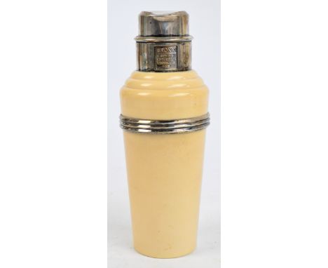 A 1930s Art Deco "The Master Incolor" cocktail shaker, cream bakelite with plated mounts, ribbed band and rotating cover deta