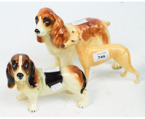 A boxed Beswick dog figure; model 972, a light brown greyhound "Jovial Roger", a model of a spaniel and a basset hound (3).  
