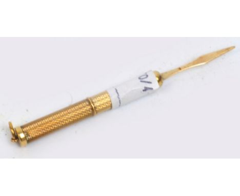 A 9ct gold cased twist action toothpick with engine turned decorated body and ring loop attachment, length when extended 7.7c