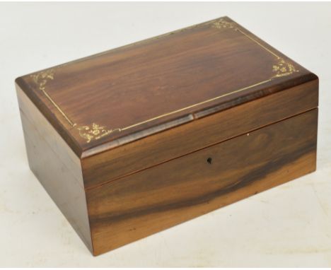 A walnut casket with inlaid decoration and button silk lining, width 26cm.