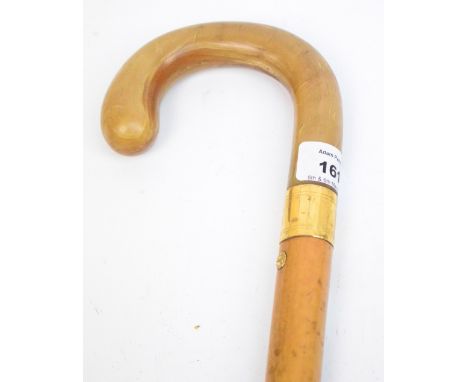 A horn handled, yellow metal mounted malacca shafted walking stick by Howell of London, England, length 90.5cm.