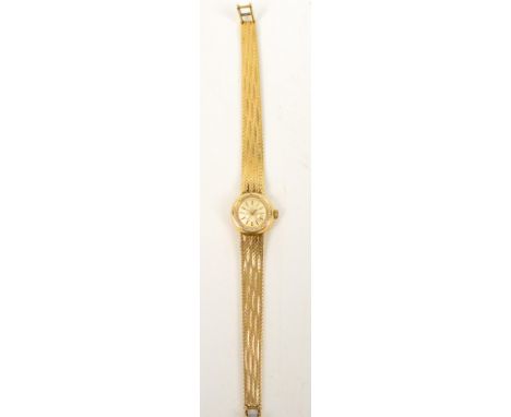 OMEGA; a boxed 9ct gold cased lady's manual wind wristwatch on 9ct gold bracelet, with papers. CONDITION REPORT: Weight appro