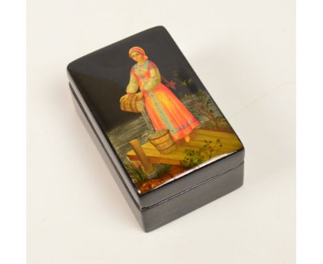 A Russian Palekh rectangular black lacquered trinket box, the hinged lid decorated with a maiden and a pail of water, dated 1