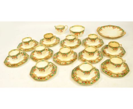 A Royal Doulton Art Deco tea service, decorated with fuchsias, comprising two bread and butter plates, twelve cups, twelve sa