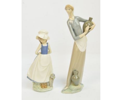 A tall Lladro figure of a girl carrying a water flask, height 33cm, and a Nao figure of a girl with a poodle (2). CONDITION R