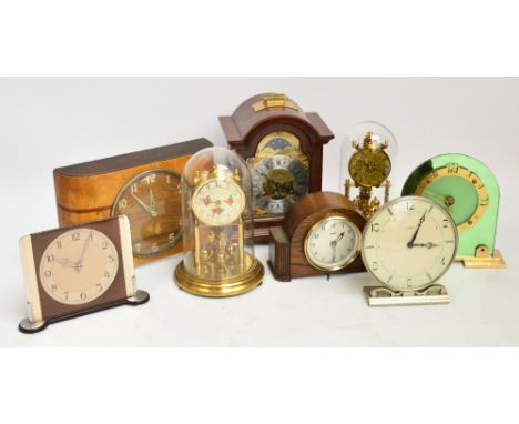 Eight various mantel clocks and time pieces including a green glass Art Deco example, two anniversary type clocks, a contempo