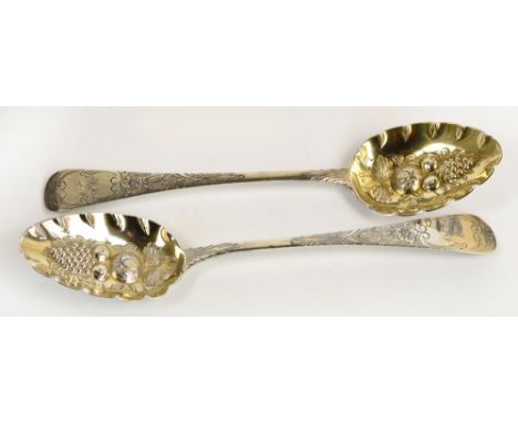 A matched pair of hallmarked silver berry spoons, engraved R to the finial within floral decoration, George Day, London 1817 