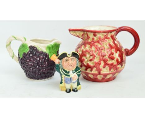 A large Beswick pink and white textured pot with a relief design of scrolling foliage, height 22cm (handle af), a large ceram