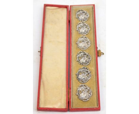 A cased set of six Edward VII hallmarked silver Art Nouveau buttons decorated with a maiden amidst floral sprays, Chester 190