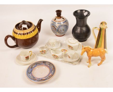A mixed lot of decorative ceramics including a Beswick palomino foal, an Isle of Man crested miniature tea service and tray, 