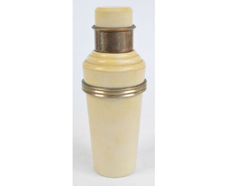 A 1930s Art Deco Incolor style bakelite and electroplated mounted cocktail shaker with ribbed band, unmarked, height 28.75cm.