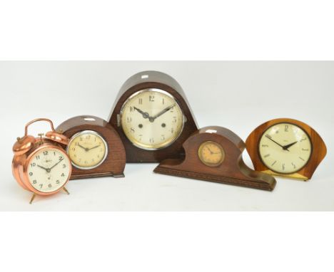 An Art Deco style oak cased mantel clock, with four other clocks (5).