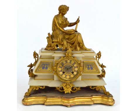A 19th century French alabaster gilt metal mounted and blue enamel decorated mantel clock, the figural surmount above stepped