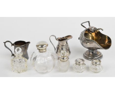 A pair of George V hallmarked silver covered clear glass dressing table jars, Levi and Solomon, Birmingham 1916, height 4cm, 