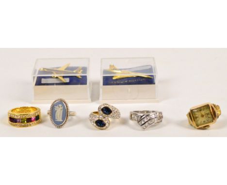 A Majorex ring watch, four assorted dress rings and two British Airways aeroplane badges.