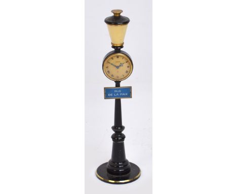 A vintage Jaeger-LeCoultre clock modelled as a French street lamp with a plaque "Rue de la Paix", the circular dial set with 