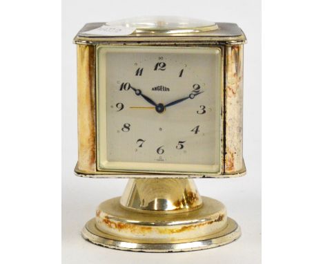A vintage Angelus revolving combination desk clock/thermometer/barometer/hygrometer with four sides and with compass set to t