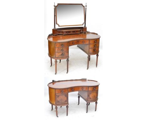 The en-suite dressing table and wash stand; an Edwardian mahogany bead decorated kidney shaped dressing table and matching wa