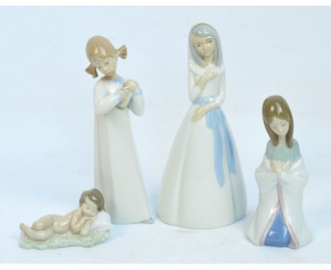 Three Lladro figures; a girl playing a musical instrument, a kneeling girl and a naked child lying asleep, and another simila