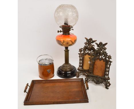 A Victorian brass oil lamp converted to electricity (af), a pair of decorative photograph frames, a small oak tray, a walnut 