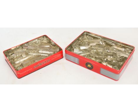 Two tins containing a large quantity of cut glass drop lustres, suitable for light fittings or table lustres.