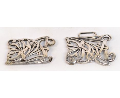 An Edward VII hallmarked silver Art Nouveau two piece buckle in the form of a stylised floral motif, William Comyns, London 1