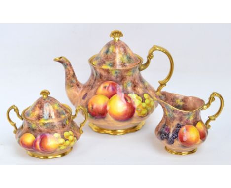 GERALD DELANEY; a three piece tea service hand painted in the Royal Worcester style with fruit, each piece signed and with pr