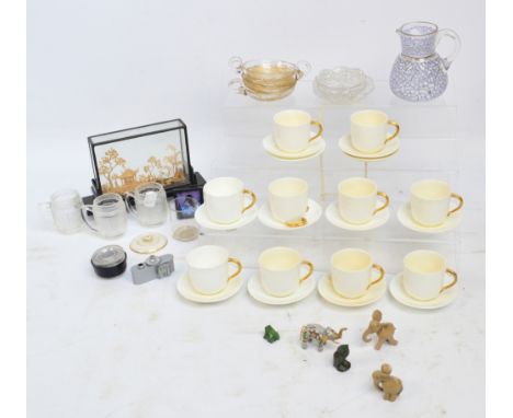 A mixed lot including a set of Coalport ivory coloured coffee cans and saucers, small cloisonné and ceramic elephants, a smal