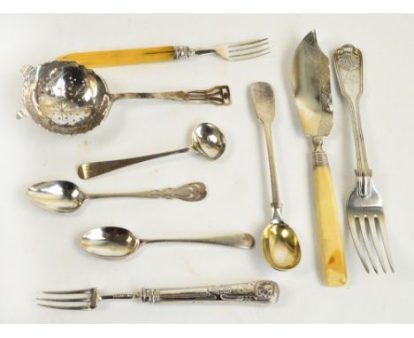 A small group of hallmarked silver flatware including a George VI hallmarked silver tea strainer with pierced geometric finia