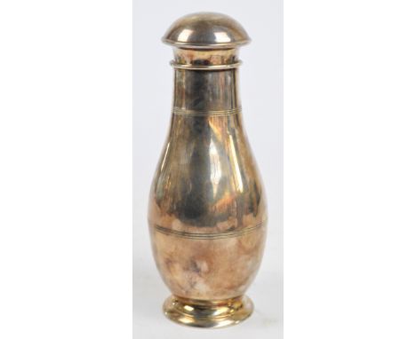 An 1930s Art Deco novelty cocktail shaker in the form of a ten pin bowling pin, the domed lift-off cap enclosing a fixed stra