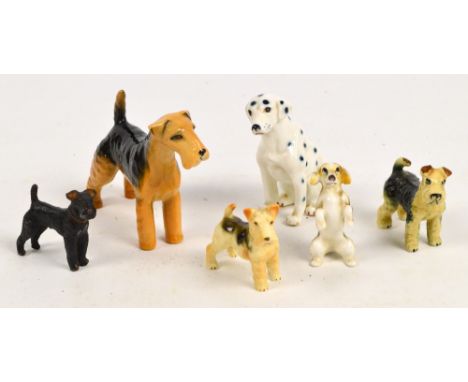 A Beswick standing terrier, a cold painted model of a Scottie, and four further ceramic dogs (6).