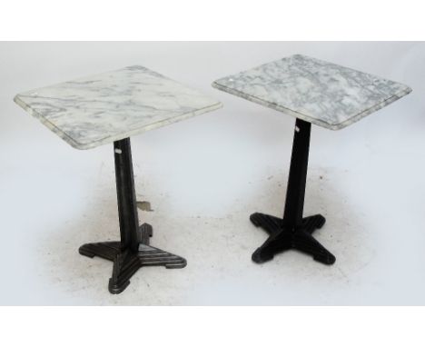 A set of four French Art Deco cast iron garden tables, each with grey veined marble square section tops above tapering centra