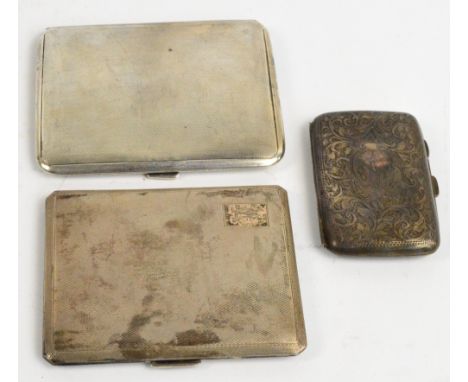 A George VI hallmarked silver cigarette case of rounded rectangular form, London 1941, a similar silver cigarette case, and a