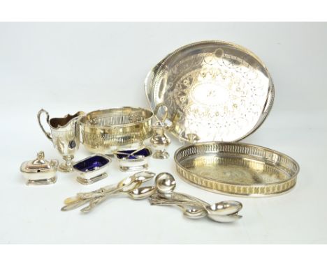 A quantity of silver plated items including a helmet shaped jug, a four piece cruet, flatware and cutlery, two trays with pie