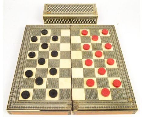 An Anglo-Indian Vizagapatam ivory and inlaid folding chessboard/backgammon board, width 44cm and a similarly decorated box, w