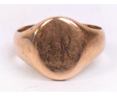 A 9ct rose gold signet ring with monogram and small presentation inscription inside, size R, 6.5g.