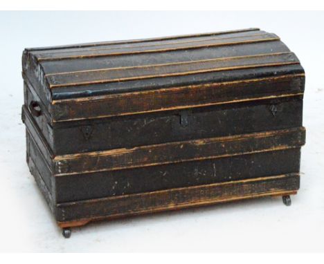 A 19th century pine domed twin handled trunk, width 82cm.