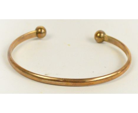 A 9ct gold bangle, approx 16g.
