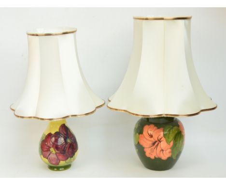 A Moorcroft lamp base in "Hibiscus" pattern on green ground, impressed marks to base, height excluding fitting 21cm, and a sm