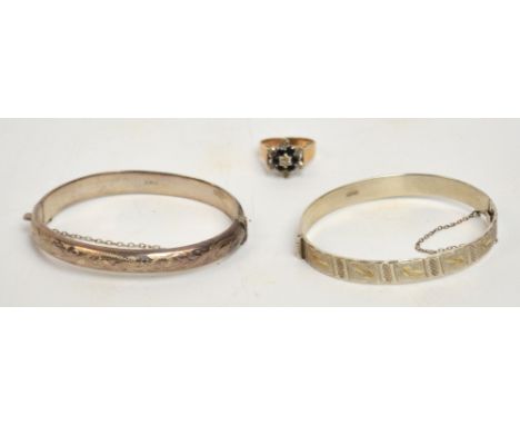 A 9ct yellow gold floral cluster dress ring and two silver snap bangles (3).