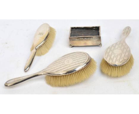 A George V hallmarked silver backed hair brush with pattern of stripes and dots, and signed circular cartouche, a similar exa