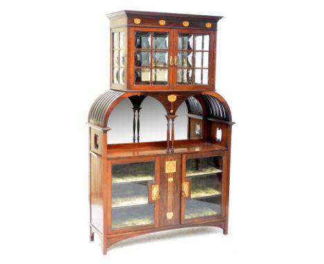 A mahogany and satinwood inlaid Art Nouveau display cabinet, the moulded cornice with copper and satinwood inlaid frieze agai