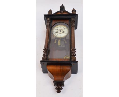 A 19th century walnut cased eight day Vienna rectangular musical wall clock, the circular white painted dial set with Roman n