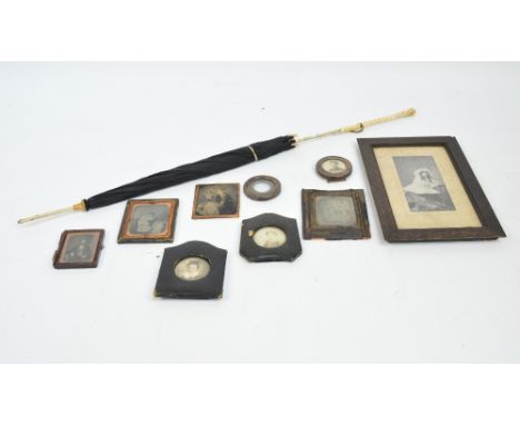 A collection of late 19th/early 20th century portrait photographs including a pair of George V hallmarked silver small circul