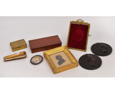 An early 20th century oval miniature portrait of a young girl, initialled "MAN", 6 x 5cm, a 19th century gilt heightened silh
