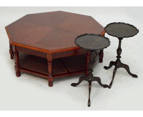 A reproduction octagonal coffee table with caned undertier on turned supports, width 97cm and two reproduction mahogany tripo