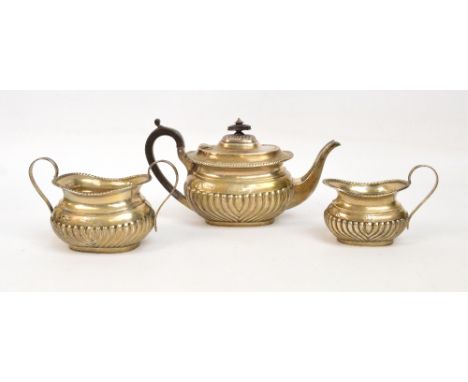 A Victorian hallmarked silver three piece tea service comprising teapot, milk jug and twin handled sucrier, each with gadroon