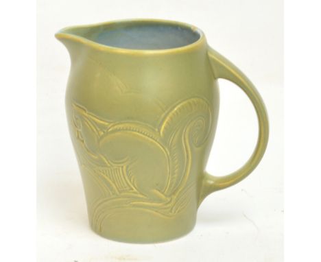 An early Susie Cooper Art Deco jug decorated with two squirrels and with loop handle, incised mark to base, dated 1932, heigh