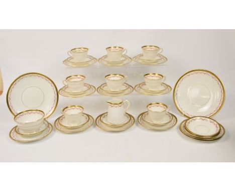 A 19th century Court china tea service retailed by Alfred B. Pearce & Co, with gilt Greek key border and transferred floral s